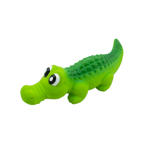 Green toy alligator on a white background